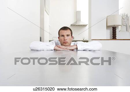 Stock Image - Young man at home. Fotosearch