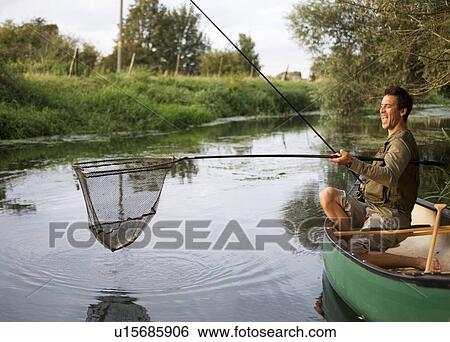 Young man fishing View Large Photo Image Stock Photograph - Young man fishing. Fotosearch