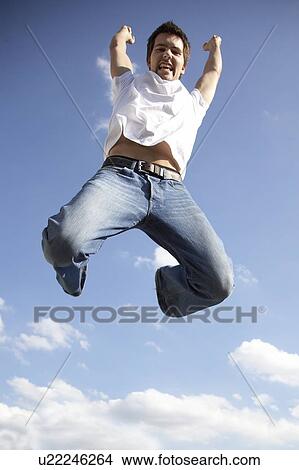 Picture - Young man jumping. Fotosearch