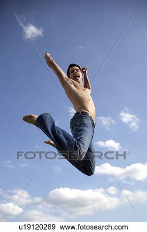 Stock Photo - Young man jumping. Fotosearch