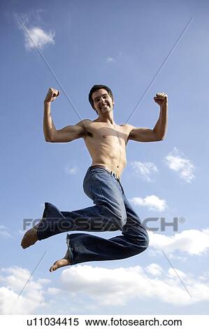 Stock Photography - Young man jumping. Fotosearch