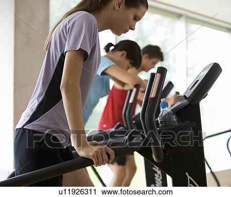 Young people at a gym View Large Photo Image Stock Image - Young people at a gym. Fotosearch