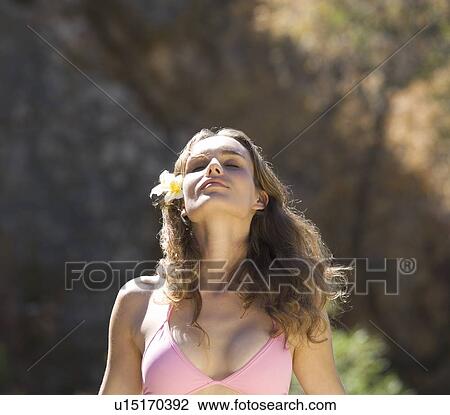 Stock Image - Young woman in a bikini, close-up. Fotosearch