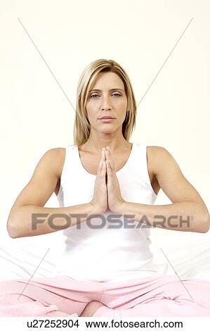 Young woman practicing yoga View Large Photo Image Picture - Young woman practicing yoga. Fotosearch