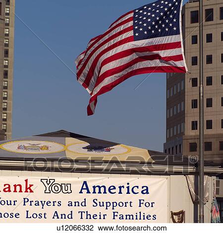 Stock Image - American Flag at World Trade Centre Memorial, New York City. Fotosearch