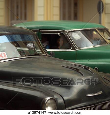 Antique cars parked, Havana, Cuba View Large Photo Image Stock Photo - Antique cars parked, Havana, Cuba. Fotosearch