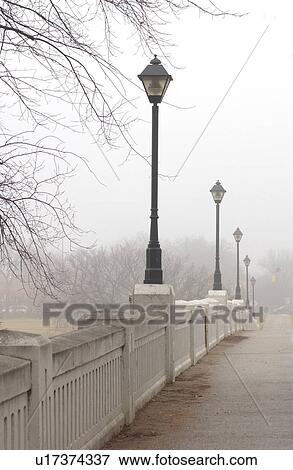 Stock Photo - autumn fog in Assiniboine Park, Winnipeg, Manitoba. Fotosearch