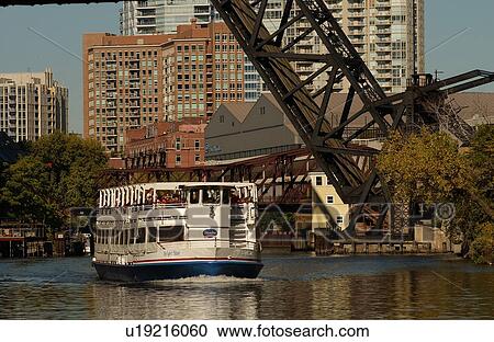 Boat passing under a bridge View Large Photo Image Stock Image - Boat passing under a bridge. Fotosearch