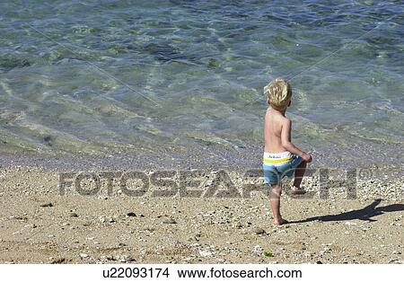 Boy at the Shore View Large Photo Image Picture - Boy at the Shore. Fotosearch