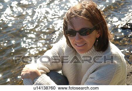 Stock Image - Brunette in Sunglasses. Fotosearch