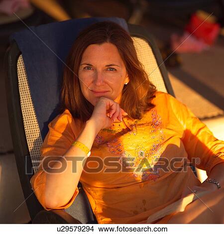 Picture - Brunette woman looking at the camera. Fotosearch