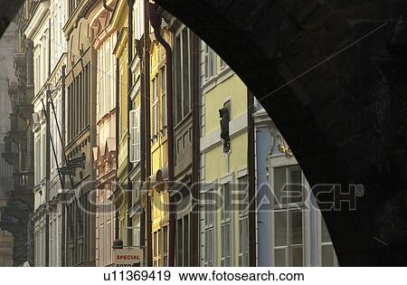 Stock Photo - Buildings seen through an archway in Prague. Fotosearch