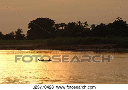 Stock Photo - Canoe on the Irrawaddy River. Fotosearch