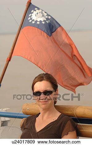 Caucasian woman with a Burmese flag over her head View Large Photo Image Stock Photo - Caucasian woman with a Burmese flag over her head. Fotosearch