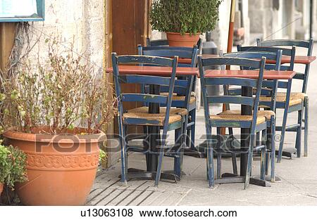 Chairs around a table at a roadside cafe in Montreal, Canada View Large Photo Image Stock Photo - Chairs around a table at a roadside cafe in Montreal, Canada. Fotosearch
