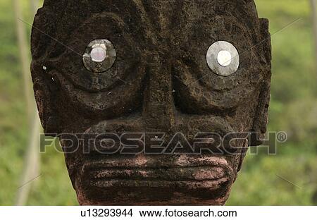 Close-up of a carved statue with silver discs for eyes View Large Photo Image Picture - Close-up of a carved statue with silver discs for eyes. Fotosearch
