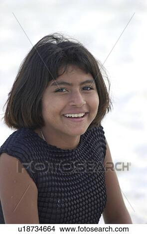 Close-up of a teenage girl smiling looking at camera View Large Photo Image Picture - Close-up of a teenage girl smiling looking at camera. Fotosearch
