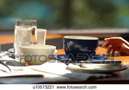 Stock Image - Cups and dishes on a table, Rocky Mountains, Canada. Fotosearch