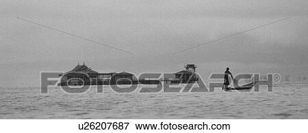 Stock Photo - Fisherman leg rowing. Fotosearch