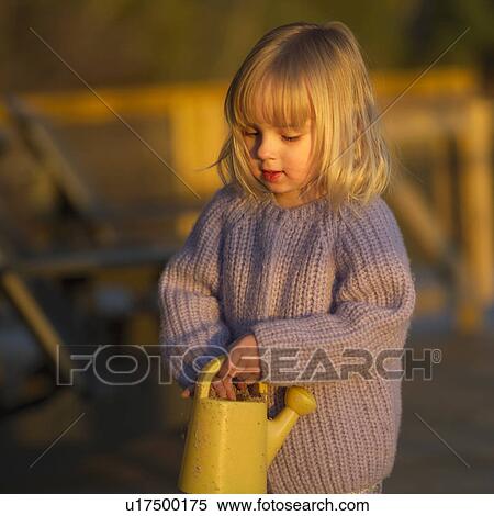 Girl with Watering Can View Large Photo Image Stock Photography - Girl with Watering Can. Fotosearch