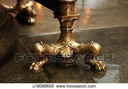 Golden ornate legs of a table View Large Photo Image Stock Photo - Golden ornate legs of a table. Fotosearch