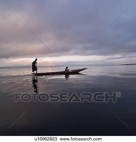 Intha fisherman in his flat-bottomed boat View Large Photo Image Stock Image - Intha fisherman in his flat-bottomed boat. Fotosearch