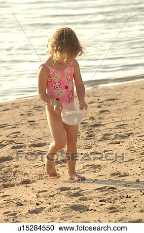 Kids playing on beach View Large Photo Image Stock Image - Kids playing on beach. Fotosearch