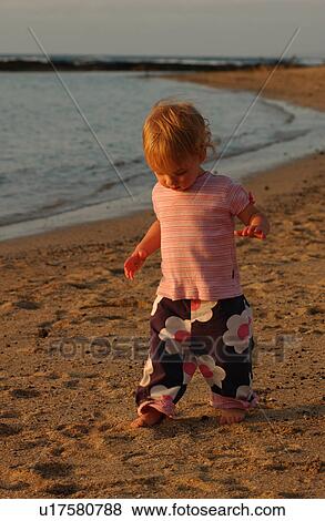 Kids playing on beach View Large Photo Image Stock Photo - Kids playing on beach. Fotosearch