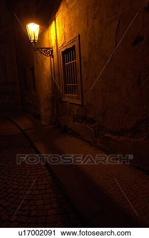 Stock Image - Lamp post lit at night in Prague. Fotosearch