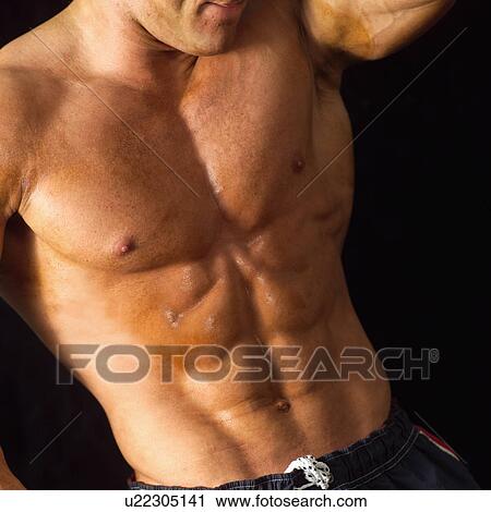 Male bodybuilder posing View Large Photo Image Stock Image - Male bodybuilder posing. Fotosearch