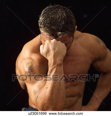 Male bodybuilder posing View Large Photo Image Stock Photo - Male bodybuilder posing. Fotosearch