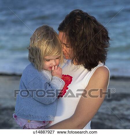 Stock Photo - Mother and Daughter on the Beach. Fotosearch