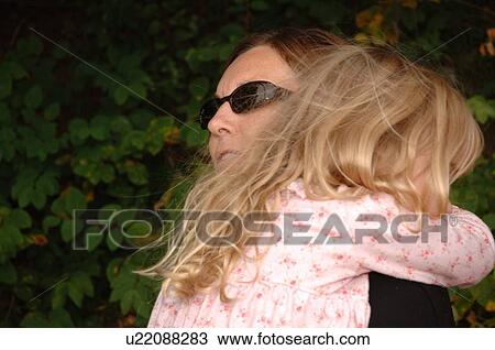 Mother hugging child View Large Photo Image Stock Image - Mother hugging child. Fotosearch