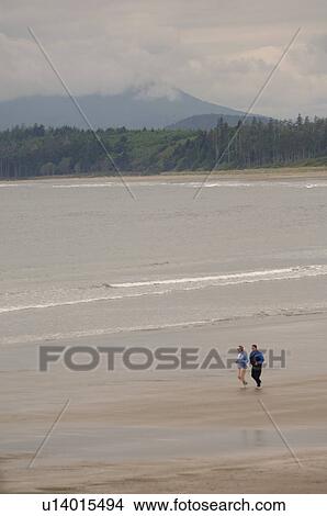 People jogging along beach, Pacific Rim NationalPark, Vancouver Island, Canada View Large Photo Image Picture - People jogging along beach, Pacific Rim NationalPark, Vancouver Island, Canada. Fotosearch