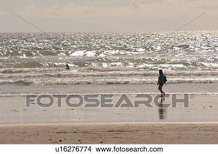 Picture - Person walking on beach, Pacific Rim National Park, Vancouver Island, Canada. Fotosearch