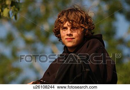 Portrait of a young boy looking ahead View Large Photo Image Picture - Portrait of a young boy looking ahead. Fotosearch