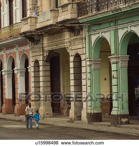 Rear view of a mother and daughter walking, Havana, Cuba View Large Photo Image Stock Photo - Rear view of a mother and daughter walking, Havana, Cuba. Fotosearch
