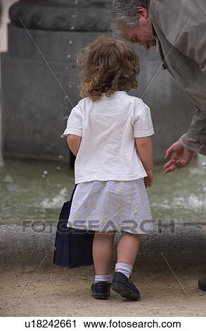 Stock Image - Rear view of a young girl. Fotosearch
