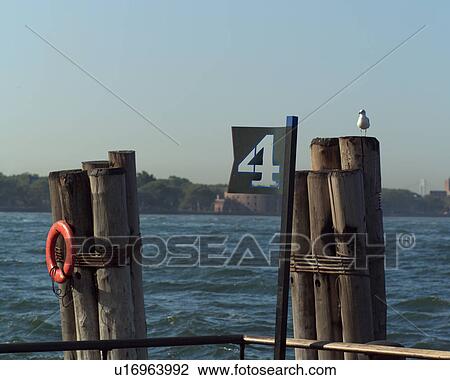 Red Life Preserver on Posts at Admiral Dewey Promenade, Battery Park, New York City View Large Photo Image Stock Image - Red Life Preserver on Posts at Admiral Dewey Promenade, Battery Park, New York City. Fotosearch
