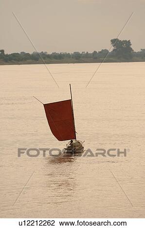 Stock Image - Sailboat on on the Irrawaddy River. Fotosearch