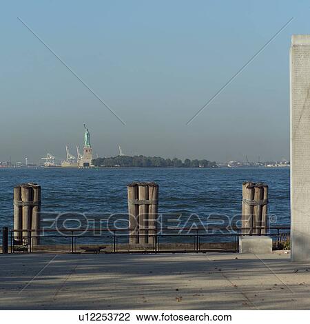 Stock Image - View of Statue of Liberty from Battery Park, New York City. Fotosearch
