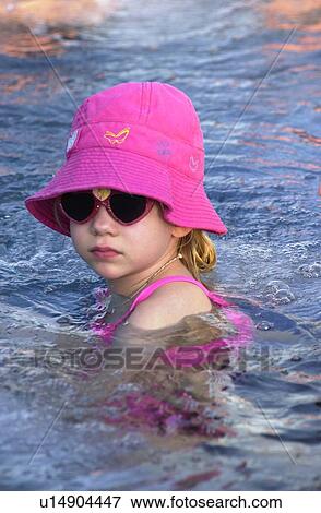 Stock Photo - Young girl in the sea. Fotosearch