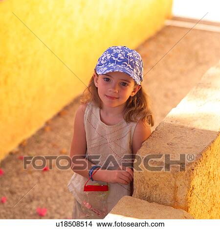 Picture - Young girl wearing a cap. Fotosearch