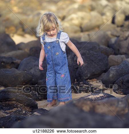 Young Lady Playing on Rocks View Large Photo Image Stock Photograph - Young Lady Playing on Rocks. Fotosearch
