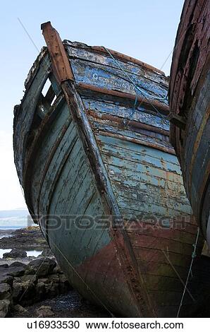 Abandoned wooden fishing boat at water's edge on sunny spring afternoon, Isle of Mull, Scotland View Large Photo Image Stock Image - Abandoned wooden fishing boat at water's edge on sunny spring afternoon, Isle of Mull, Scotland. Fotosearch