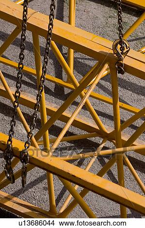 aerial view of crane boom with chains, shadows on ground View Large Photo Image Picture - aerial view of crane boom with chains, shadows on ground. Fotosearch