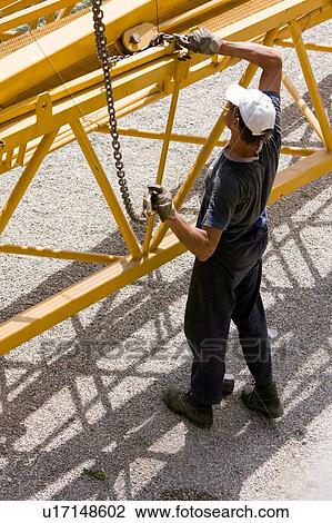 Aerial view of workman assembling crane boom on ground View Large Photo Image Stock Image - Aerial view of workman assembling crane boom on ground. Fotosearch