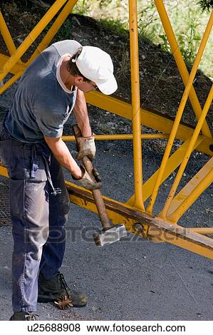 aerial view of workmen assembling crane boom to be lifted from ground View Large Photo Image Stock Photo - aerial view of workmen assembling crane boom to be lifted from ground . Fotosearch