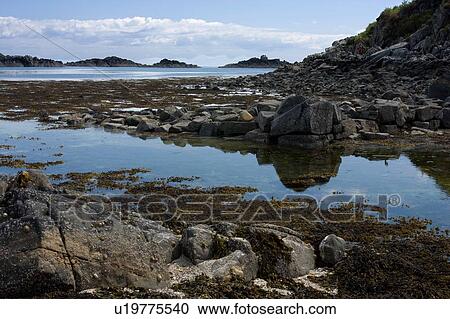 Arolainish Bay, Isle of Mull, Scotland, with tidal pools at beach reflecting blue sky and white cloud formations, View Large Photo Image Stock Image - Arolainish Bay, Isle of Mull, Scotland, with tidal pools at beach reflecting blue sky and white cloud formations, . Fotosearch