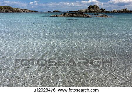 Arolainish Bay, Isle of Mull, Scotland, clear shimmering water at shoreline, with rocks in distance View Large Photo Image Stock Photograph - Arolainish Bay, Isle of Mull, Scotland, clear shimmering water at shoreline, with rocks in distance. Fotosearch